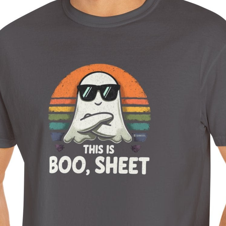 Man wearing a gray t-shirt with a ghost graphic and text on a white background