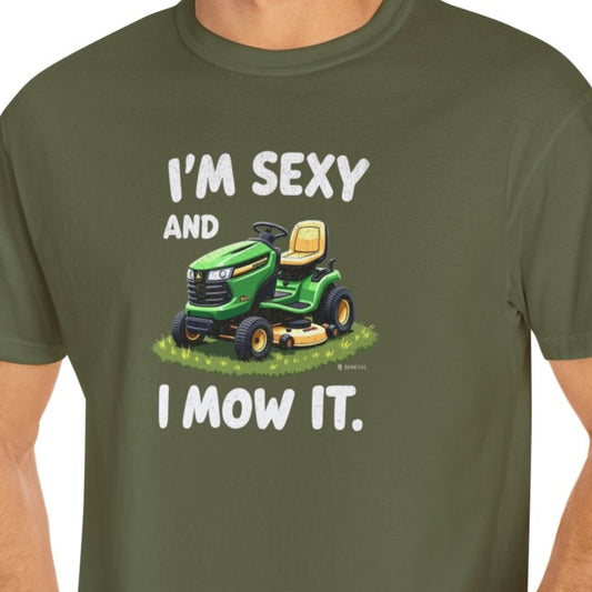 Man wearing a green t-shirt with a graphic and text on a white background