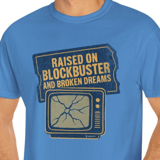 Man wearing a blue t-shirt with text and graphic design on a white background